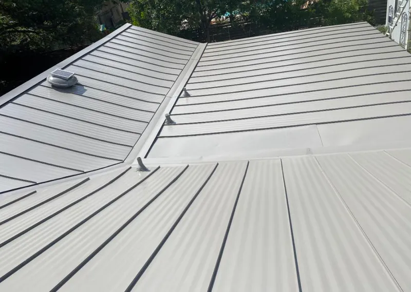 Solar attic fan installed on a metal roof for Roof Ventilation in Key Largo